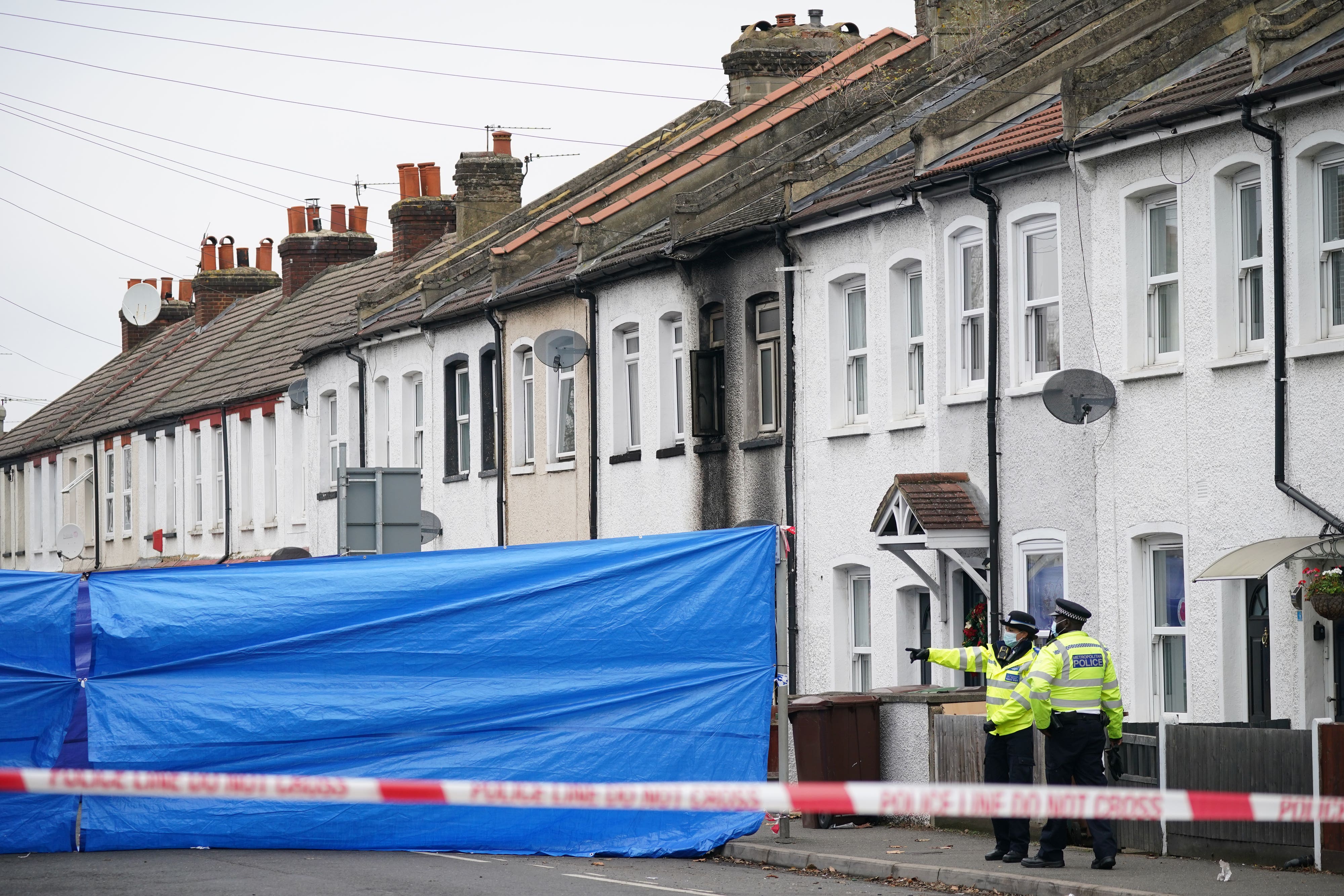 Police at a property in Collingwood Road, Sutton, south London, where brothers Kyson and Bryson Hoath, aged four, and Leyton and Logan Hoath, aged three, died in a fire (Yui Mok/PA)