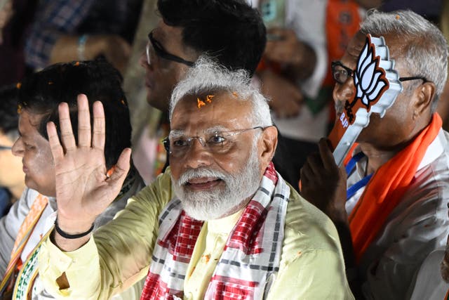 <p>India’s prime minister and leader of the ruling Bharatiya Janata Party Narendra Modi waves to supporters during an election campaign rally</p>