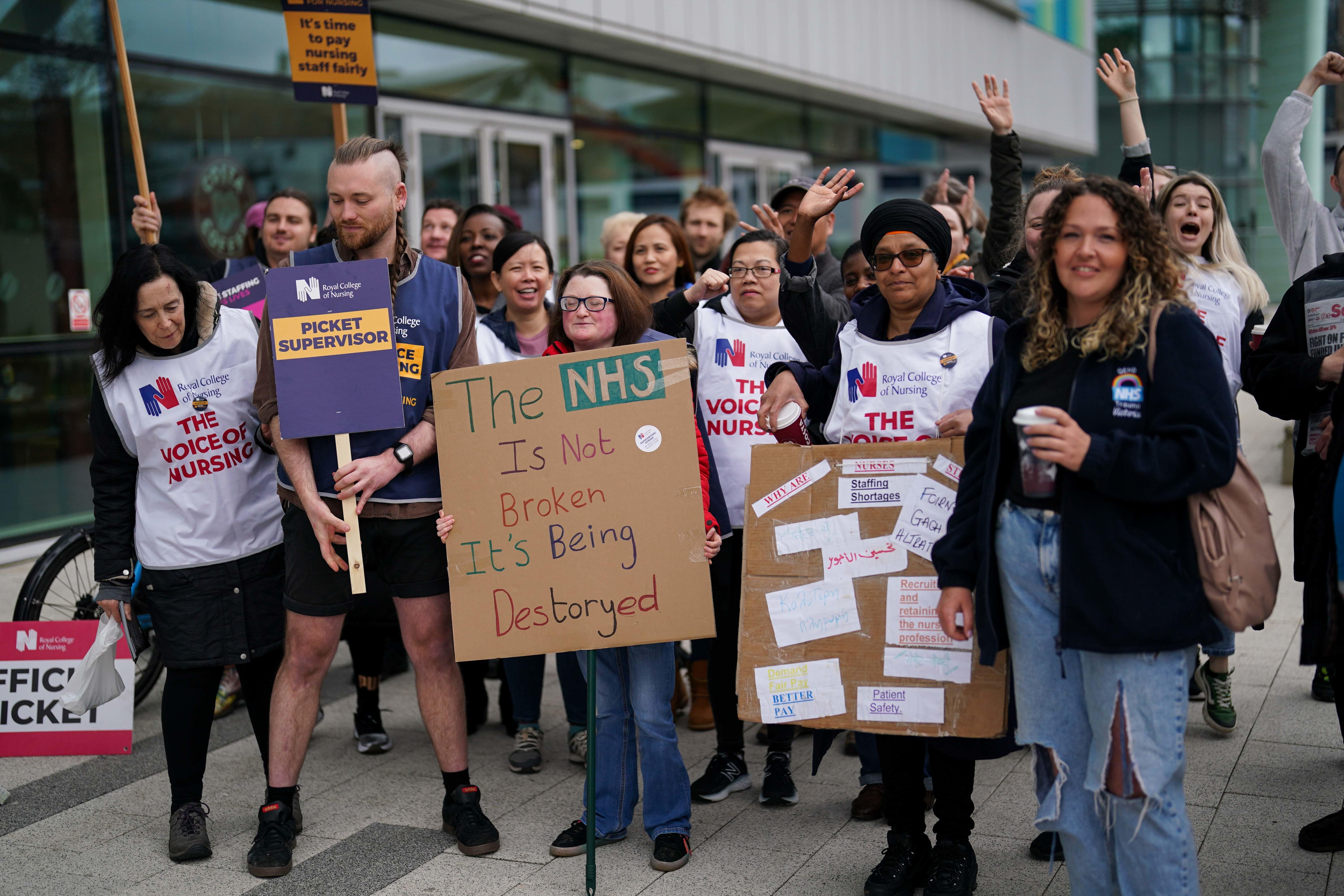 Members of the Royal College of Nursing union on the picket line outside Queen Elizabeth hospital in Birmingham (Jacob King/PA)