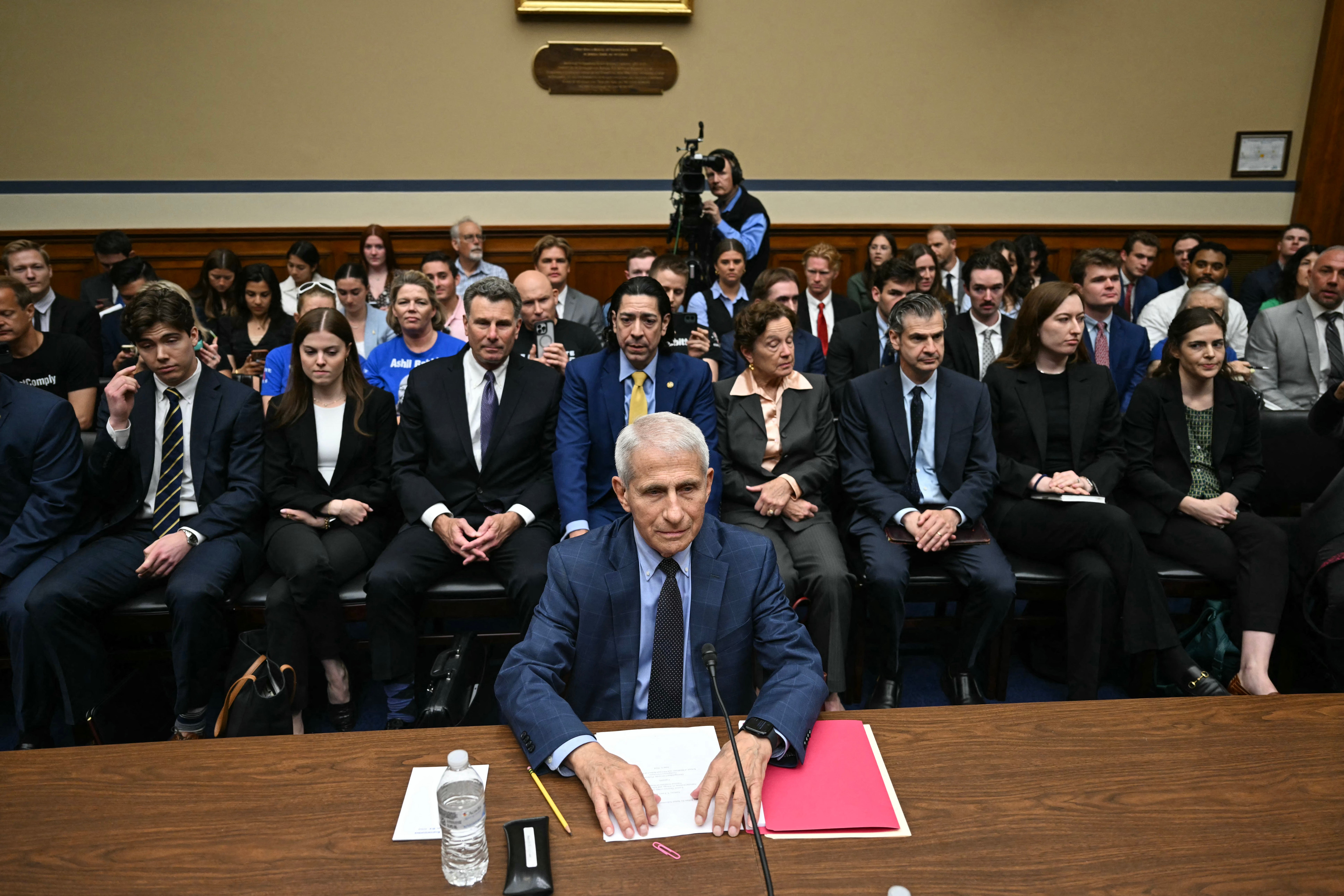 Anthony Fauci takes his seat ahead of a bruising House hearing about Covid on Monday