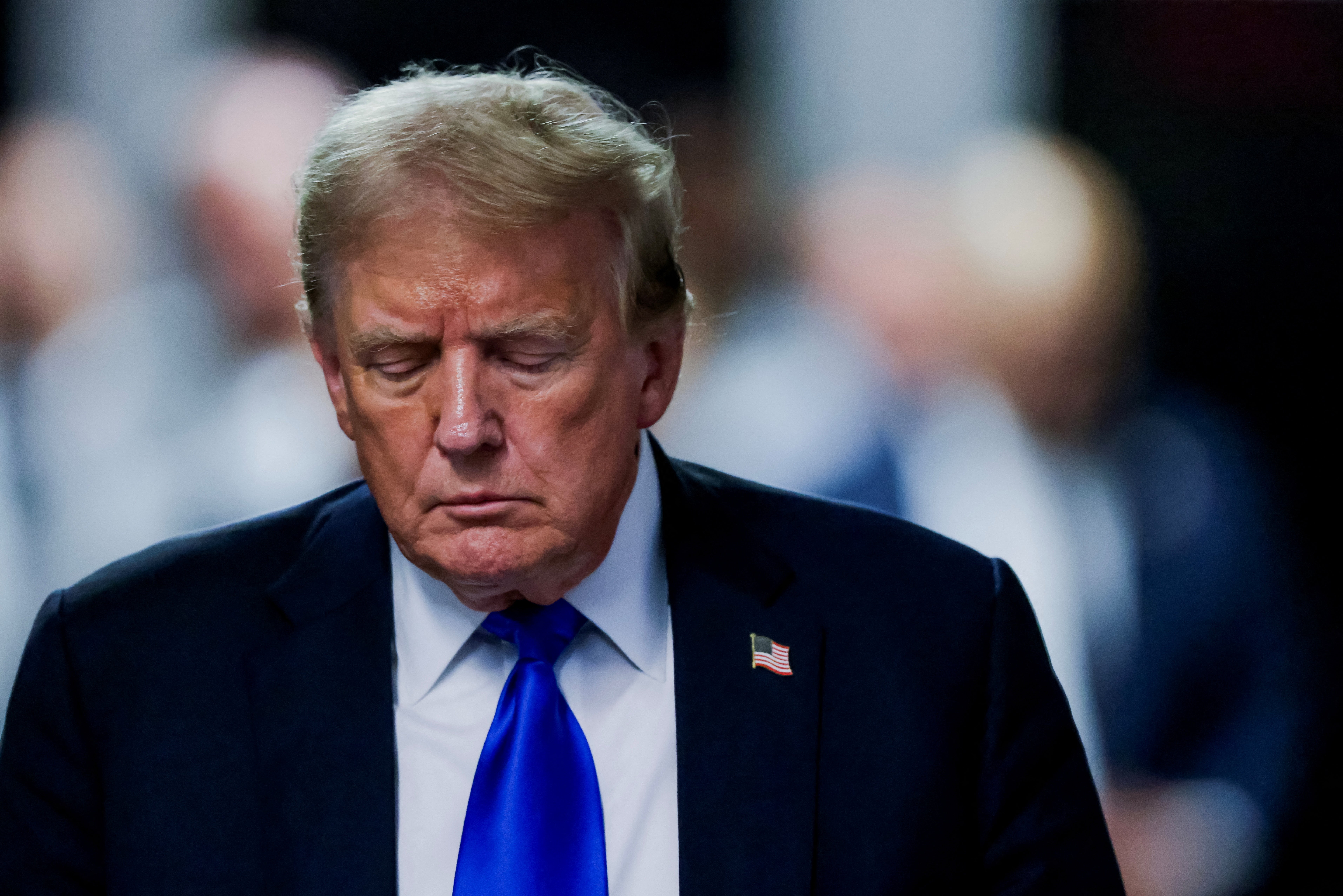 Donald Trump leaves a Manhattan courtroom after a jury convicted him on 34 counts of falsifying business records on May 30