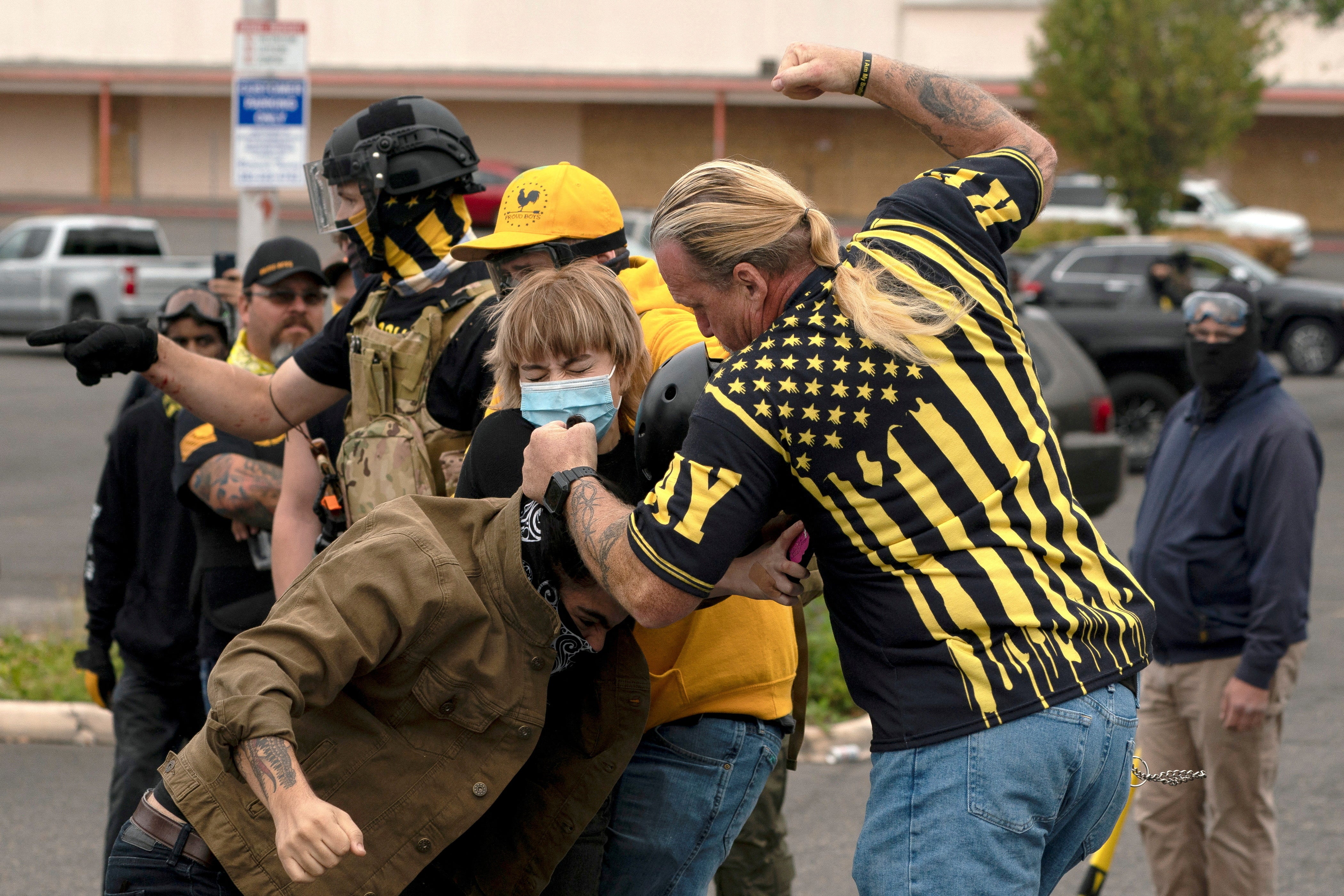Members of the far-right Proud Boys clash with counter-protesters during rival rallies in Portland, Oregon, U.S., August 22, 2021