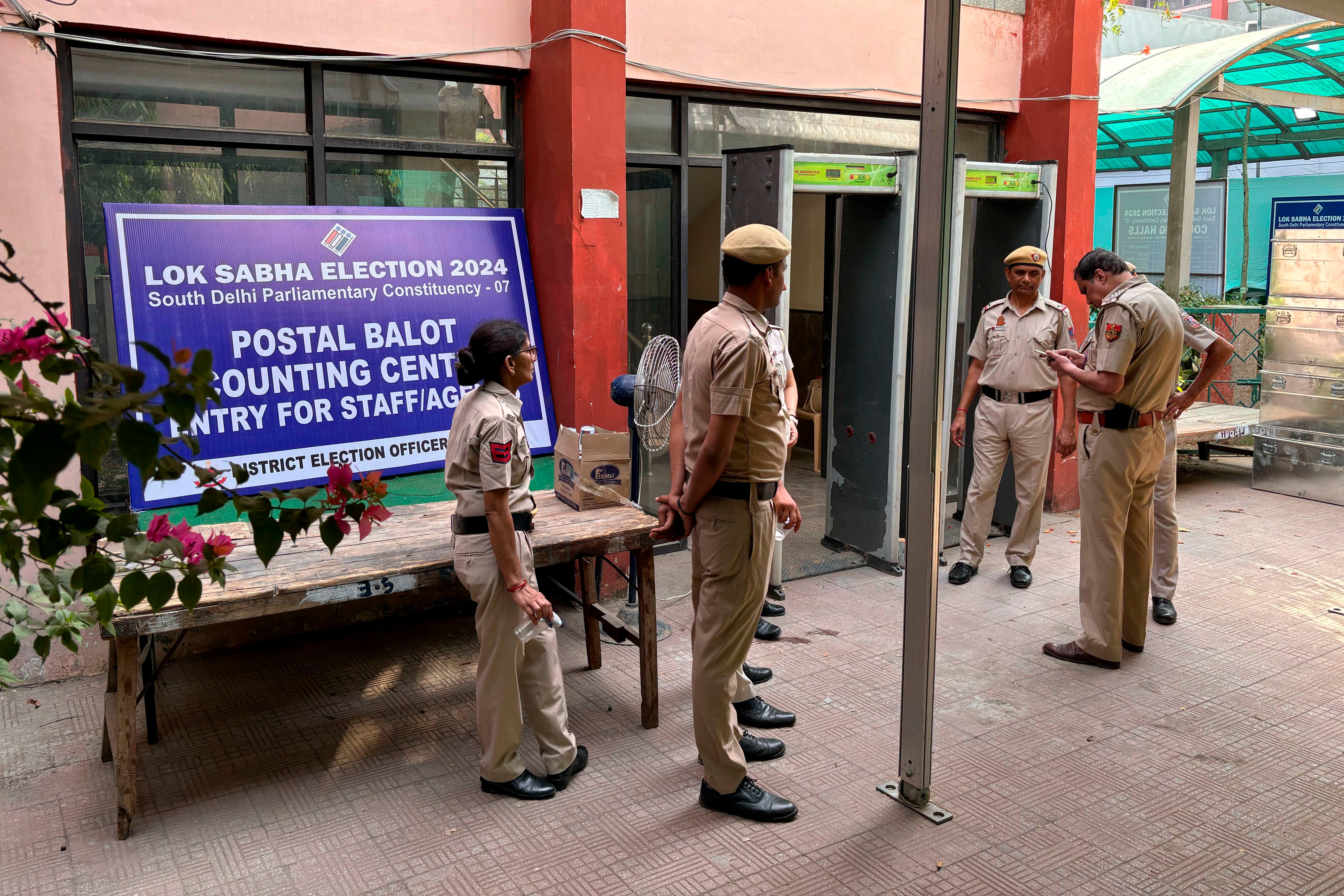 Policemen stand guard outside a counting center in New Delhi, India, Tuesday, 4 June 2024