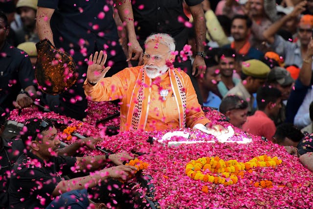 <p>Narendra Modi during a campaign roadshow in the northern city of Varanasi</p>