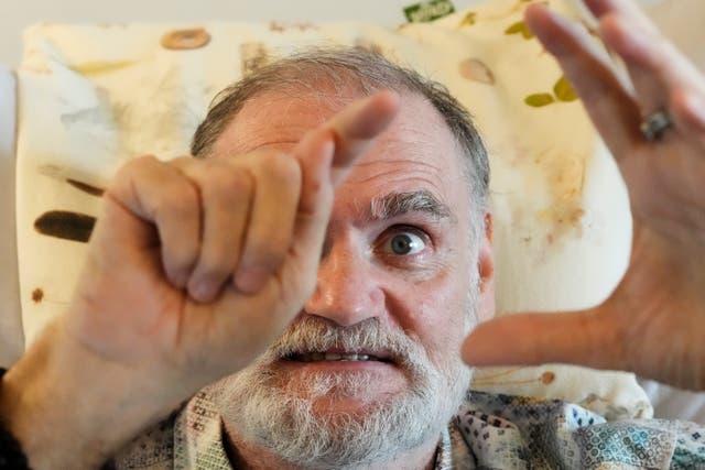 <p>Michael Bommer, who is terminally ill with colon cancer, gestures during a meeting with The Associated Press at his home in Berlin, Germany, Wednesday, May 22, 2024. Bommer, who has only a few more weeks to live</p>