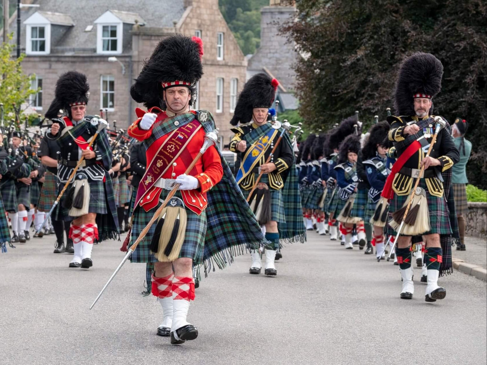Tartan army: Pipe band marching at Ballater Highland Games