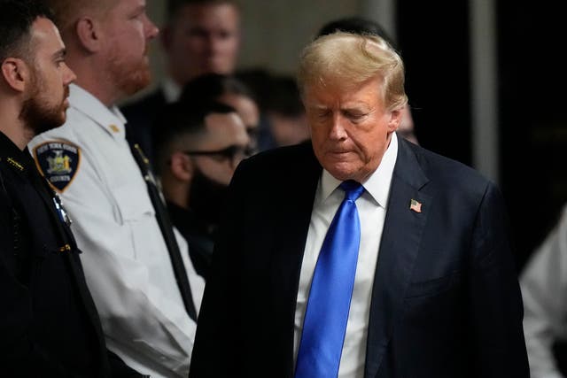 <p>Former President Donald Trump walks to make comments to media after being found guilty on 34 felony counts of falsifying business records in the first degree at Manhattan Criminal Court, Thursday, May 30, 2024, in New York</p>