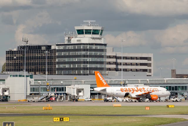 <p>Local police met the aircraft at Manchester Airport’s Terminal 1 </p>