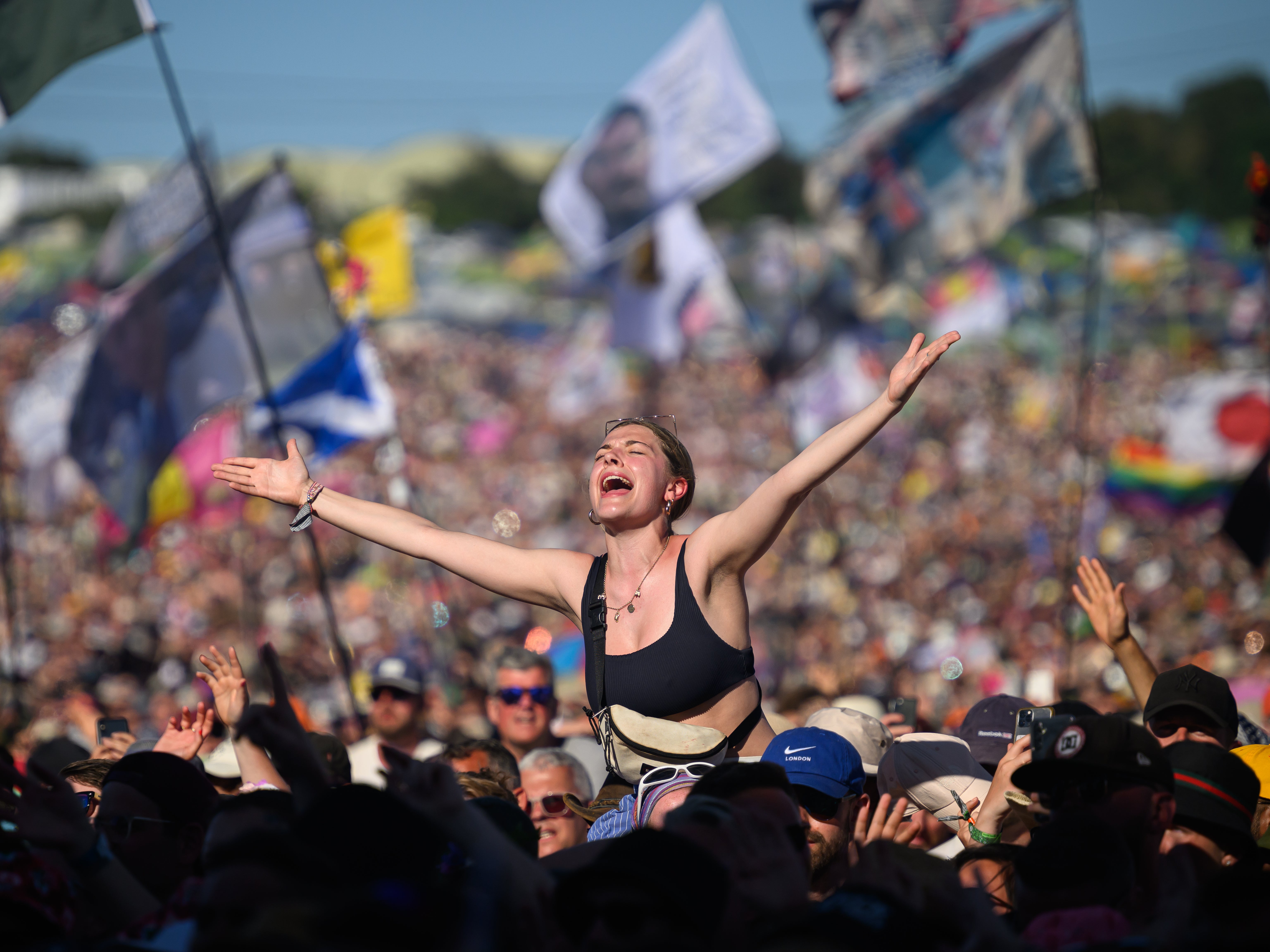 A reveller sings along as Lewis Capaldi performs on the Pyramid Stage at Glastonbury 2023