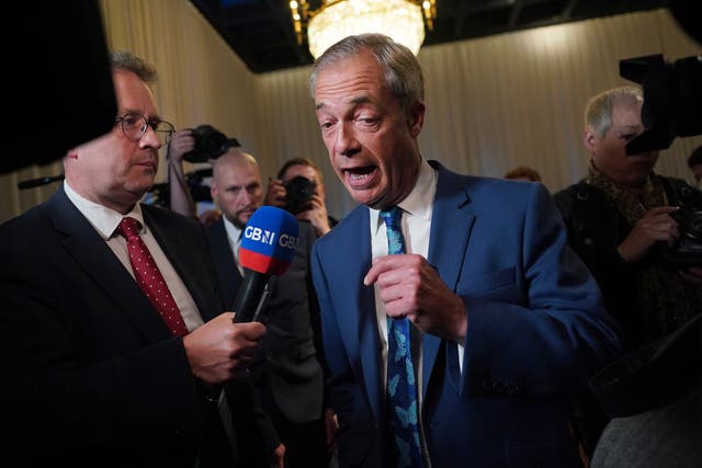 <p>Nigel Farage is interviewed by GB News following a Reform UK press conference</p>