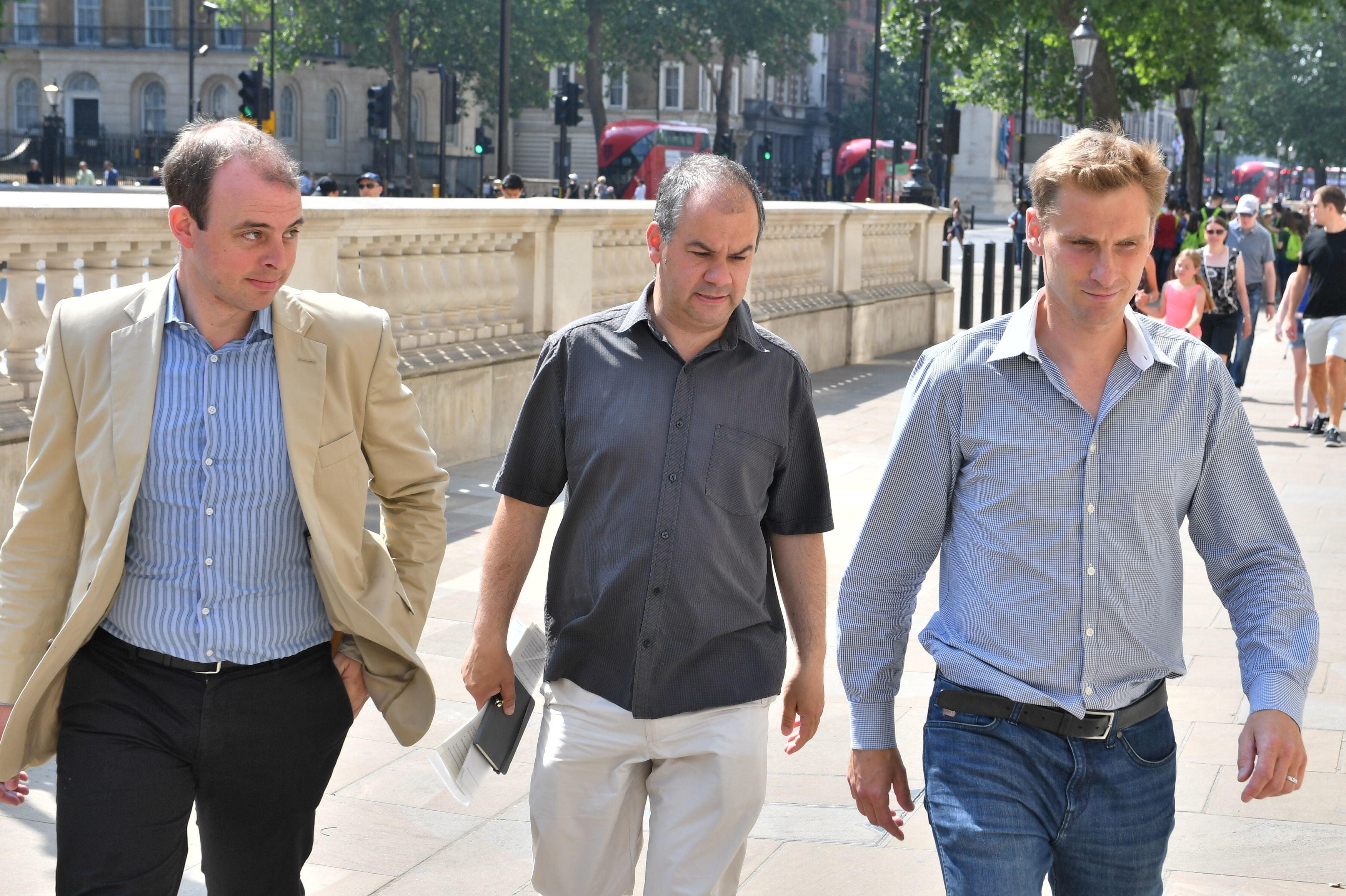 Left to right: MPs Matt Warman, Paul Scully and Chris Philp arrive ahead of a briefing for Conservative MPs on the cabinet's Brexit plans in Whitehall, central London