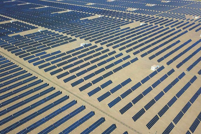 <p>An aerial photo taken on 10 August, 2019, shows solar panels in the Gobi desert, in Dunhuang in China’s northwestern Gansu province</p>