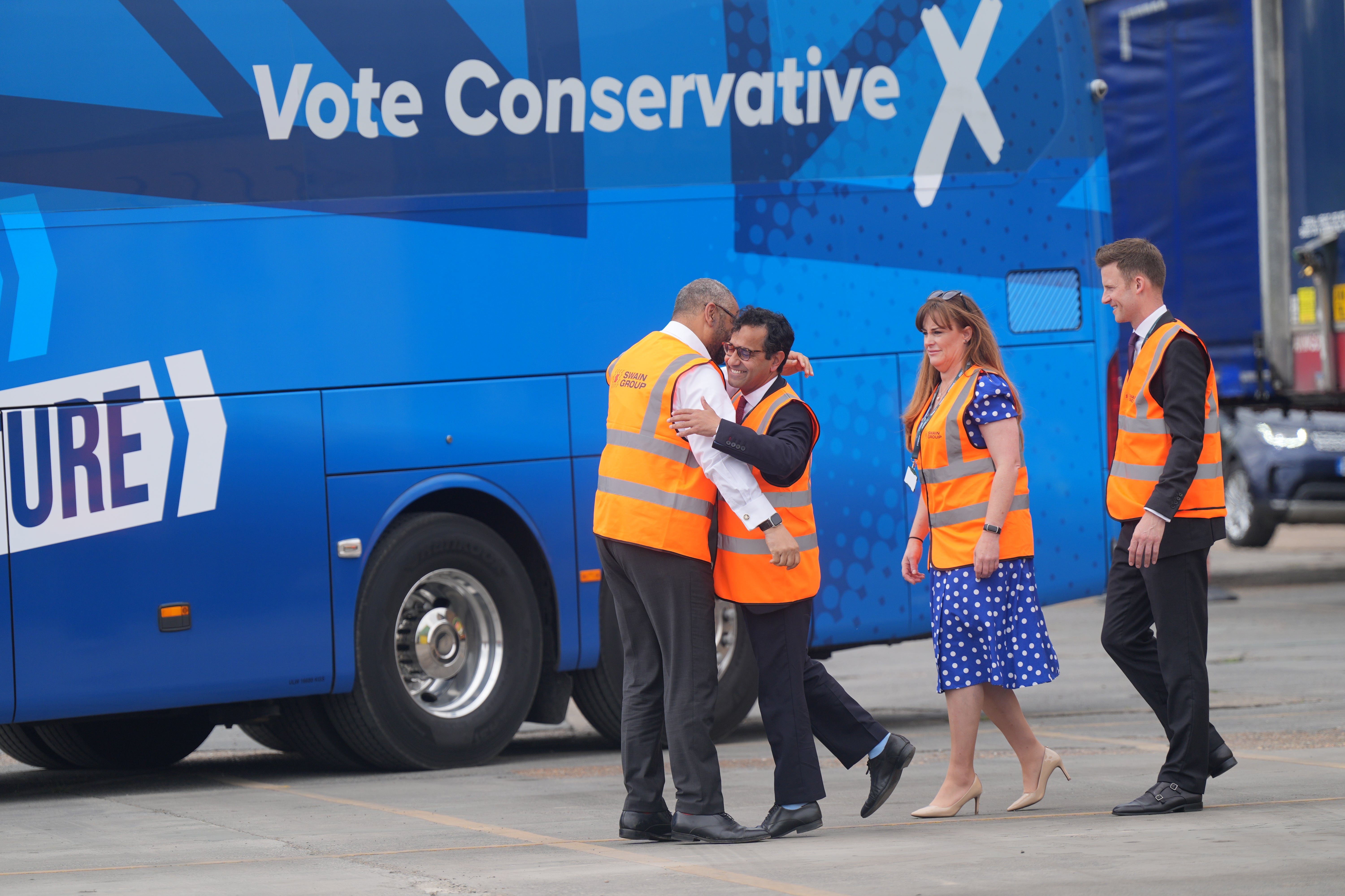 Cleverly is greeted as he arrives for a visit to Swain Group in Rochester, Kent