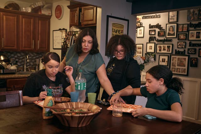 <p>Elena Romero, second from left, and her daughters Gabriela Durham, 17, left, Gionna Durham, 13 second from right, and Grace Durham, 11, have dinner together on Saturday, Jan. 27, 2024, in New York</p>