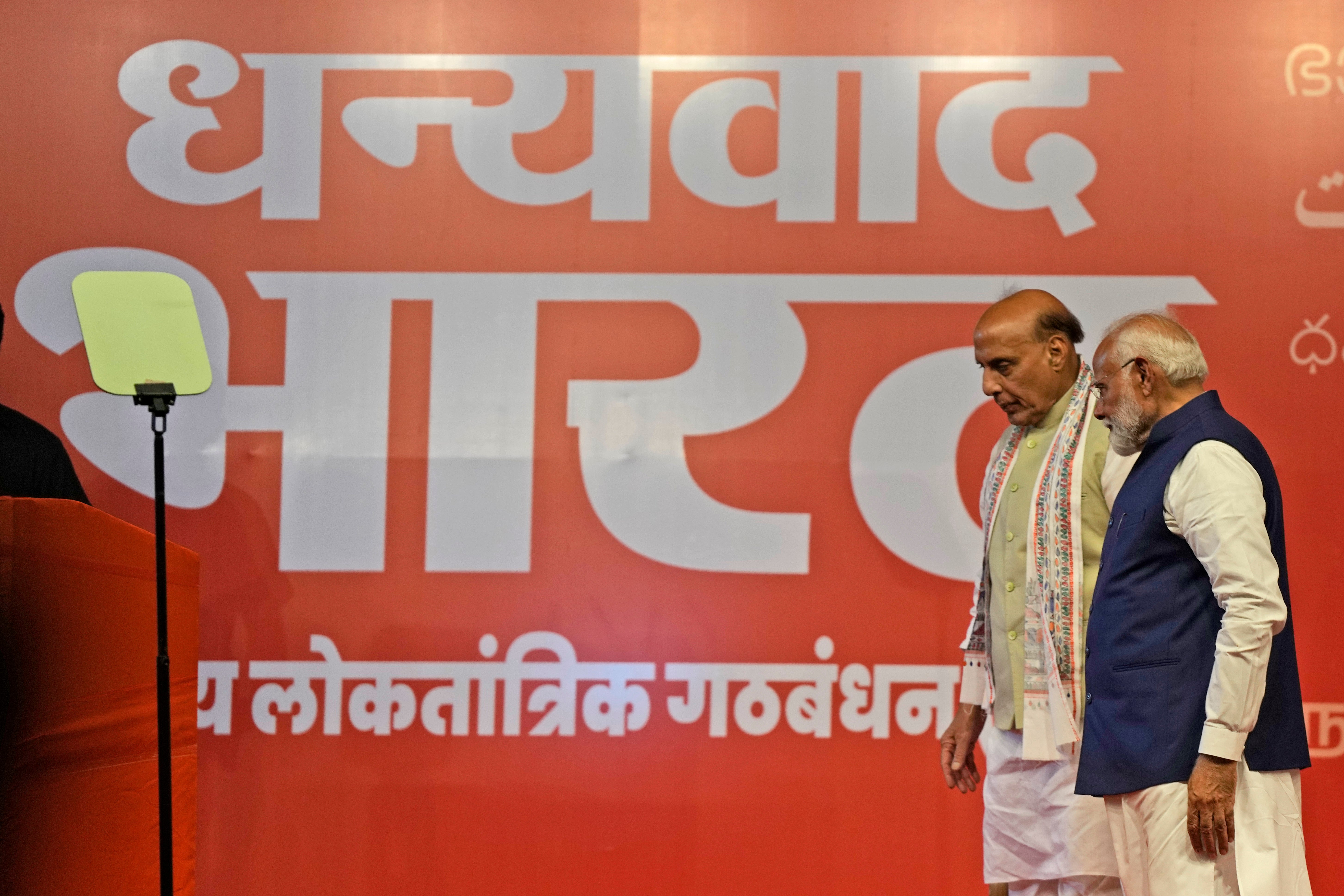 Prime minister Narendra Modi, right, with Defense Minister Rajnath Singh leaves after addressing supporters at the Bharatiya Janata Party (BJP) headquarters, in New Delhi, India, Tuesday, June 4, 2024