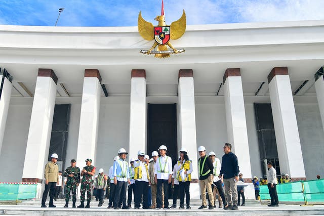 <p>In this photo released by Indonesian Presidential Palace, Indonesian President Joko Widodo, center, inspects the presidential palace construction site at the new capital city Nusantara in Penajam Paser Utara, East Kalimantan, Indonesia, Wednesday, June 5, 2024</p>