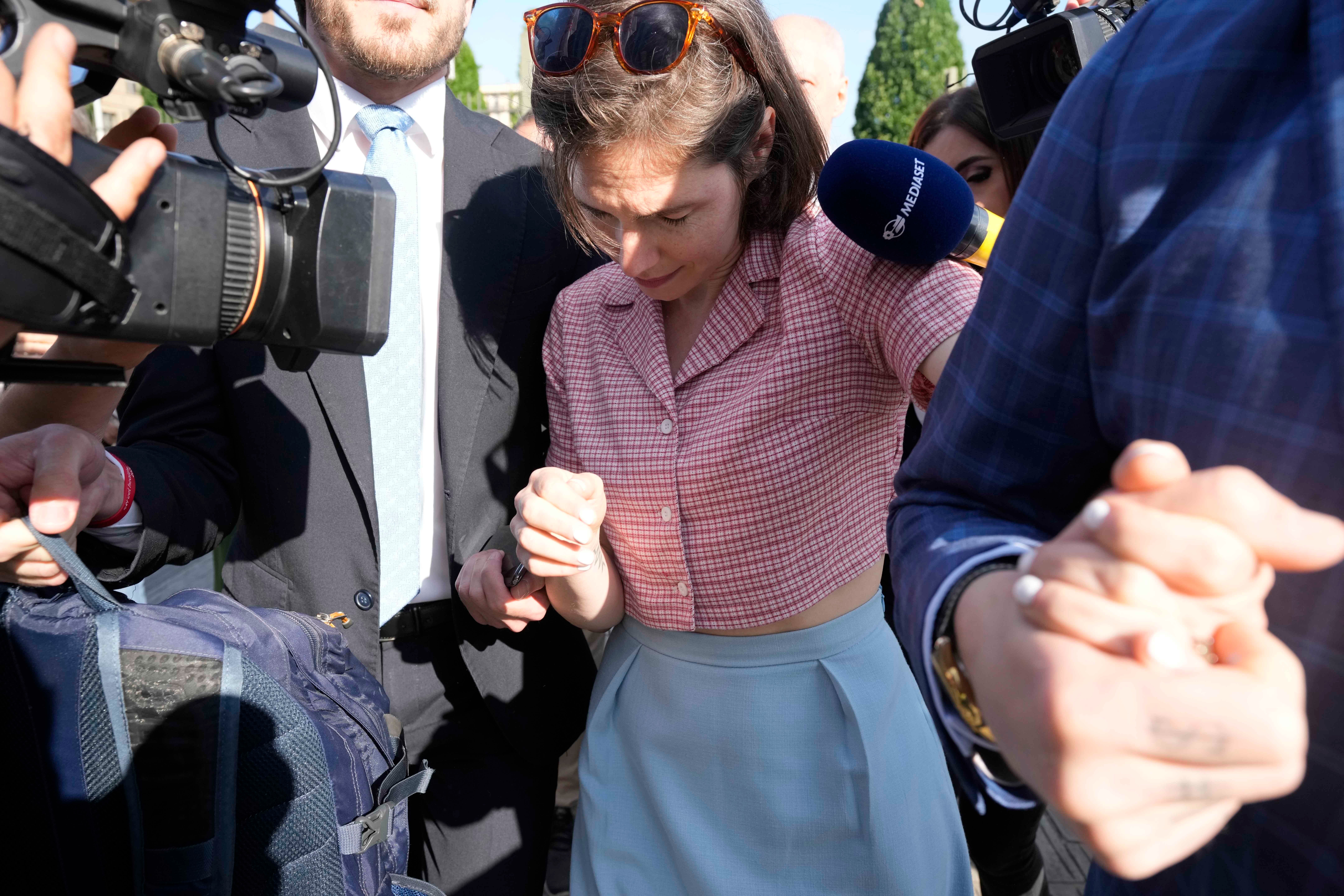 Knox was jostled by members of the media as she arrived