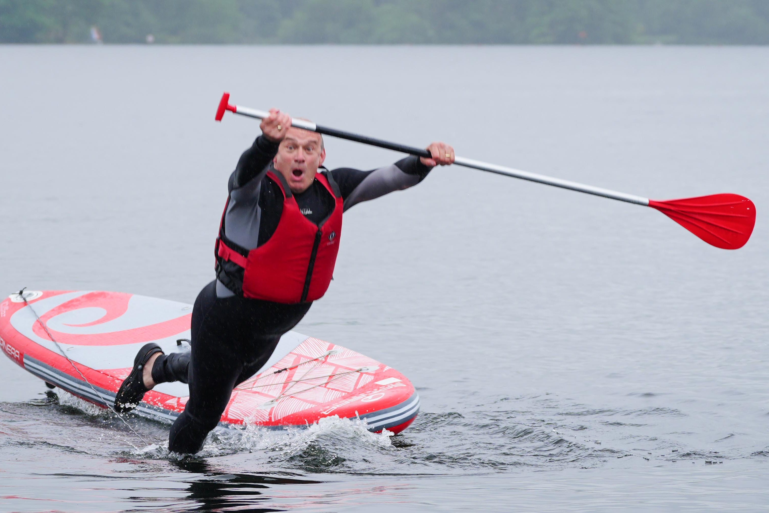 Liberal Democrat leader Sir Ed Davey falls in while paddleboarding on Windermere