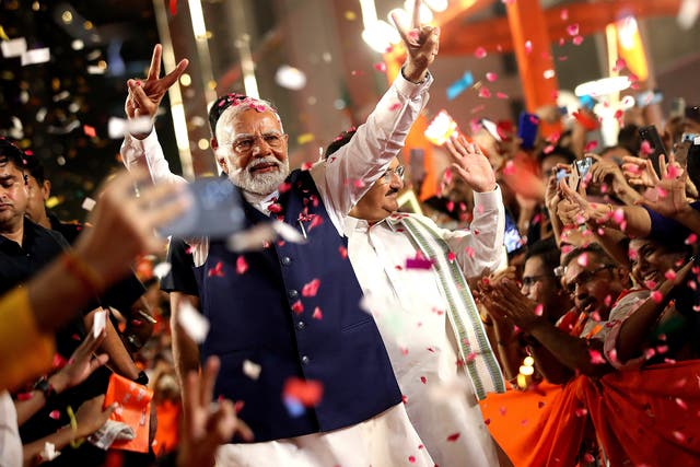 <p>Bharatiya Janata Party (BJP) leader and Indian Prime Minister Narendra Modi (C)  arrives at the party headquarters to deliver a victory speech, in New Delhi</p>
