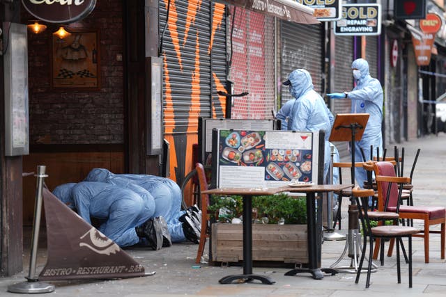 Forensic officers attended the scene in Kingsland Road, east London (James Manning/PA)