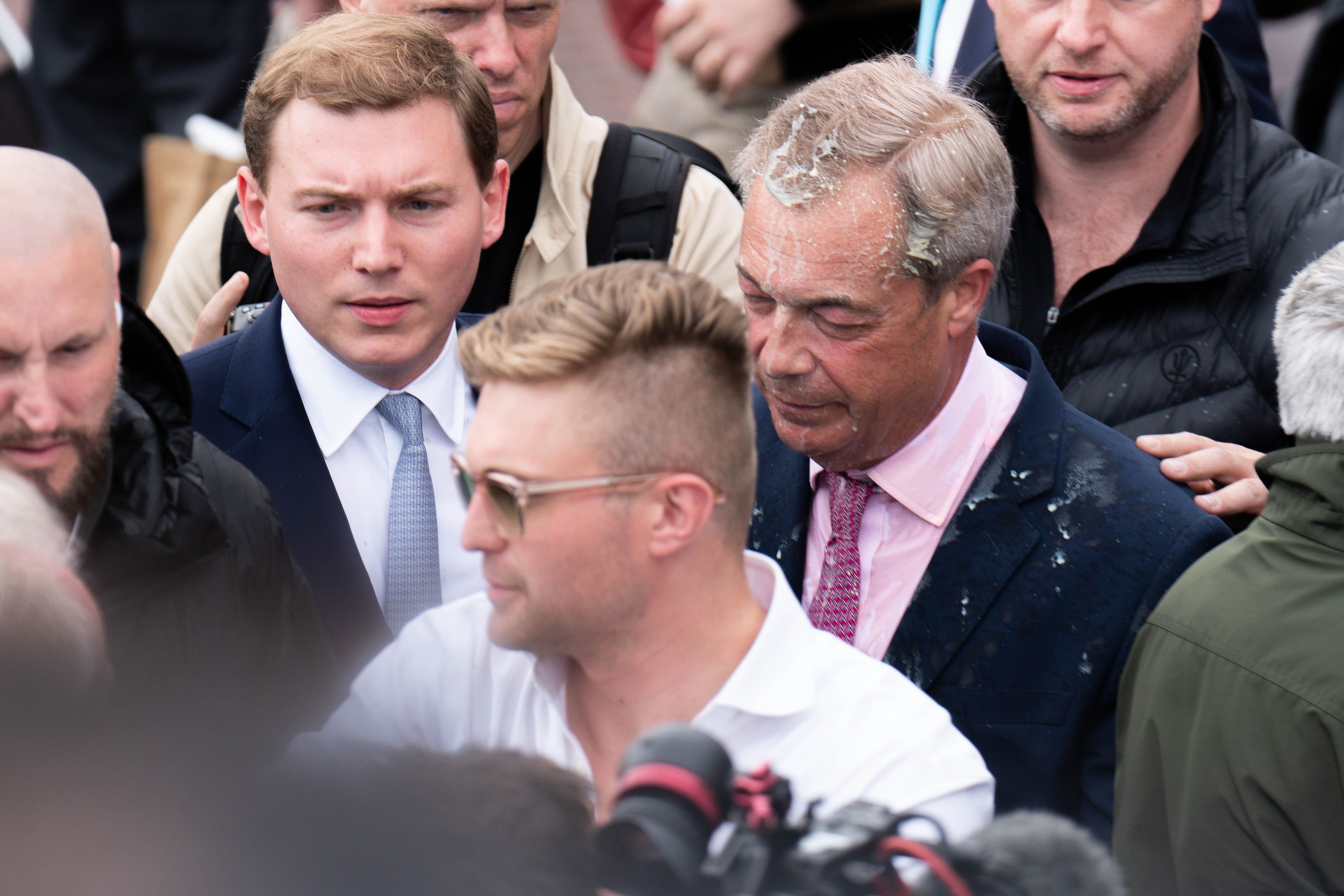 Leader of Reform UK Nigel Farage had a milkshake thrown over him as he left the Moon and Starfish pub after launching his General Election campaign in Clacton-on-Sea, Essex (James Manning/PA)
