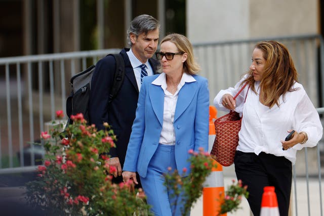 <p>Kathleen Buhle (center) is testifying in her ex-husband’s federal gun charges trial in Wilmington, Delaware </p>