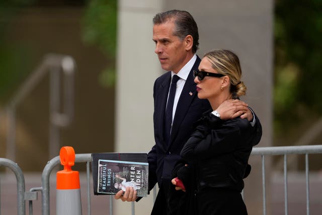 <p>Hunter Biden, left, departs from federal court with his wife, Melissa Cohen Biden on 5 June</p>