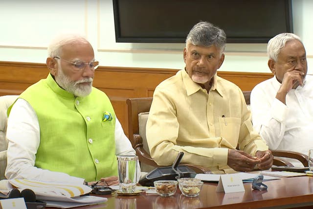 <p> Indian prime minister elect Narendra Modi, left, is sitting next to Telugu Desam Party leader N Chandrababu Naidu, center, and Janata Dal (United) leader Nitish Kumar.</p>