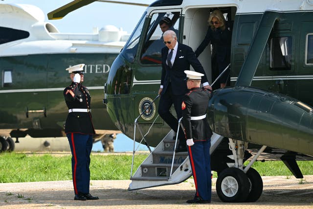 US President Joe Biden and US First Lady Jill Biden disembark Marine One as they arrive to attend the US ceremony marking the 80th anniversary of the World War II "D-Day" Allied landings in Normandy, at the Normandy American Cemetery and Memorial in Colleville-sur-Mer, which overlooks Omaha Beach in northwestern France