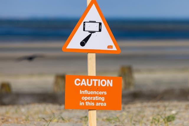 <p>Social media poseurs are high up on the list of things Brits find annoying at the beach </p>