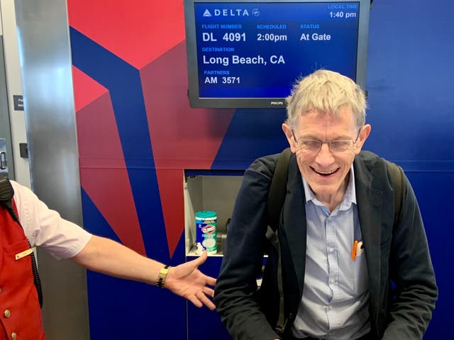<p>Happy chap: Simon Calder after learning his Delta flight from Salt Lake City to Long Beach is overbooked, and being offered $600 to travel on a later departure</p>
