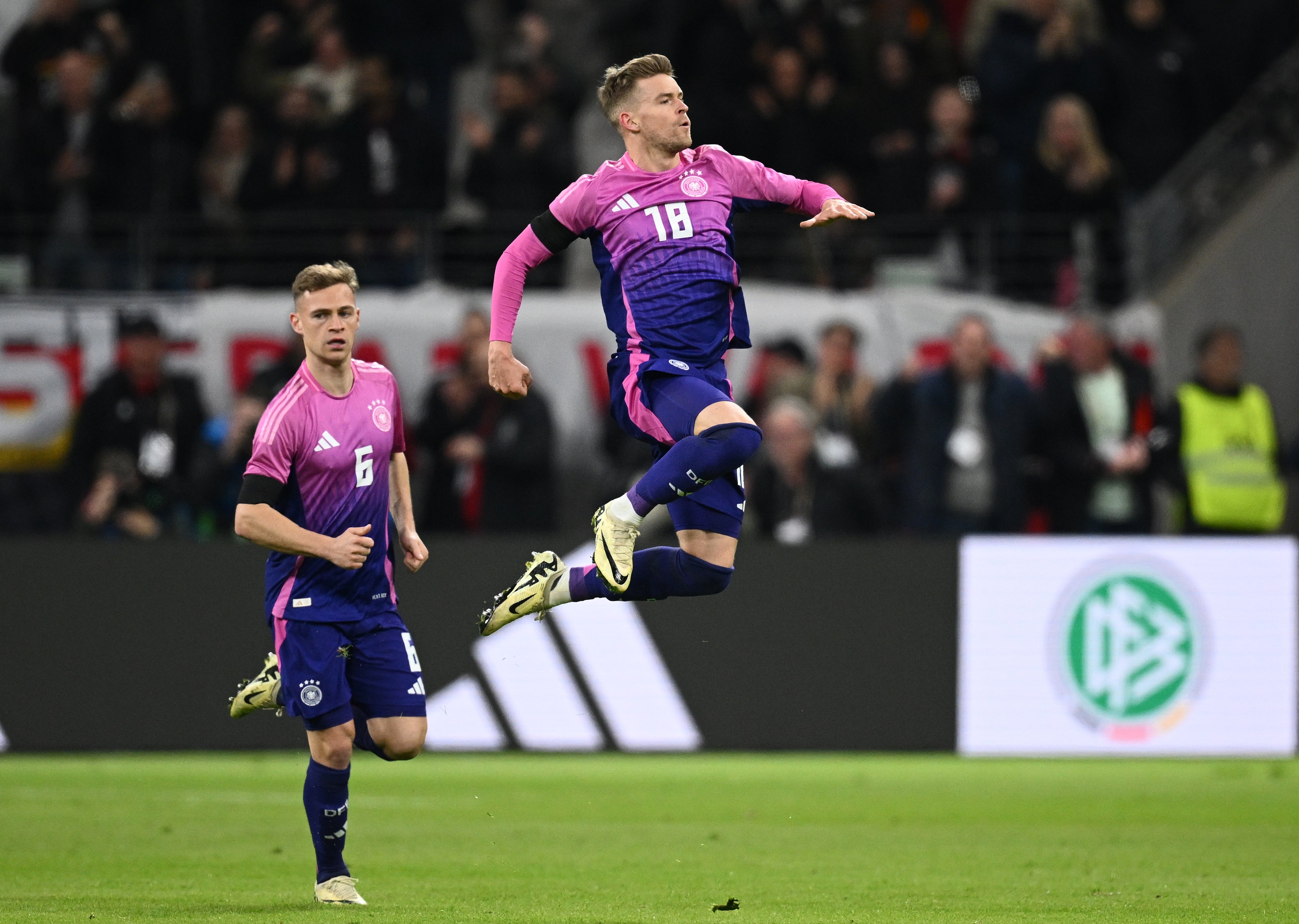 Max Mittelstädt (right) celebrates alongside Joshua Kimmich