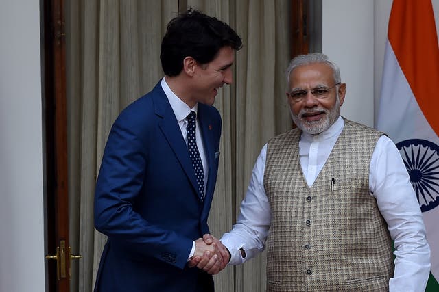 <p>Canadian Prime Minister Justin Trudeau (L) and Indian Prime Minister Narendra Modi shake hands before a meeting at Hyderabad house in New Delhi on February 23, 2018</p>
