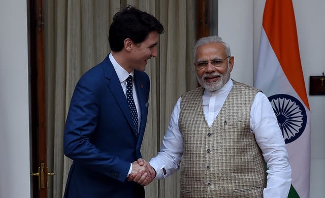<p>Canadian Prime Minister Justin Trudeau (L) and Indian Prime Minister Narendra Modi shake hands before a meeting at Hyderabad house in New Delhi on February 23, 2018</p>