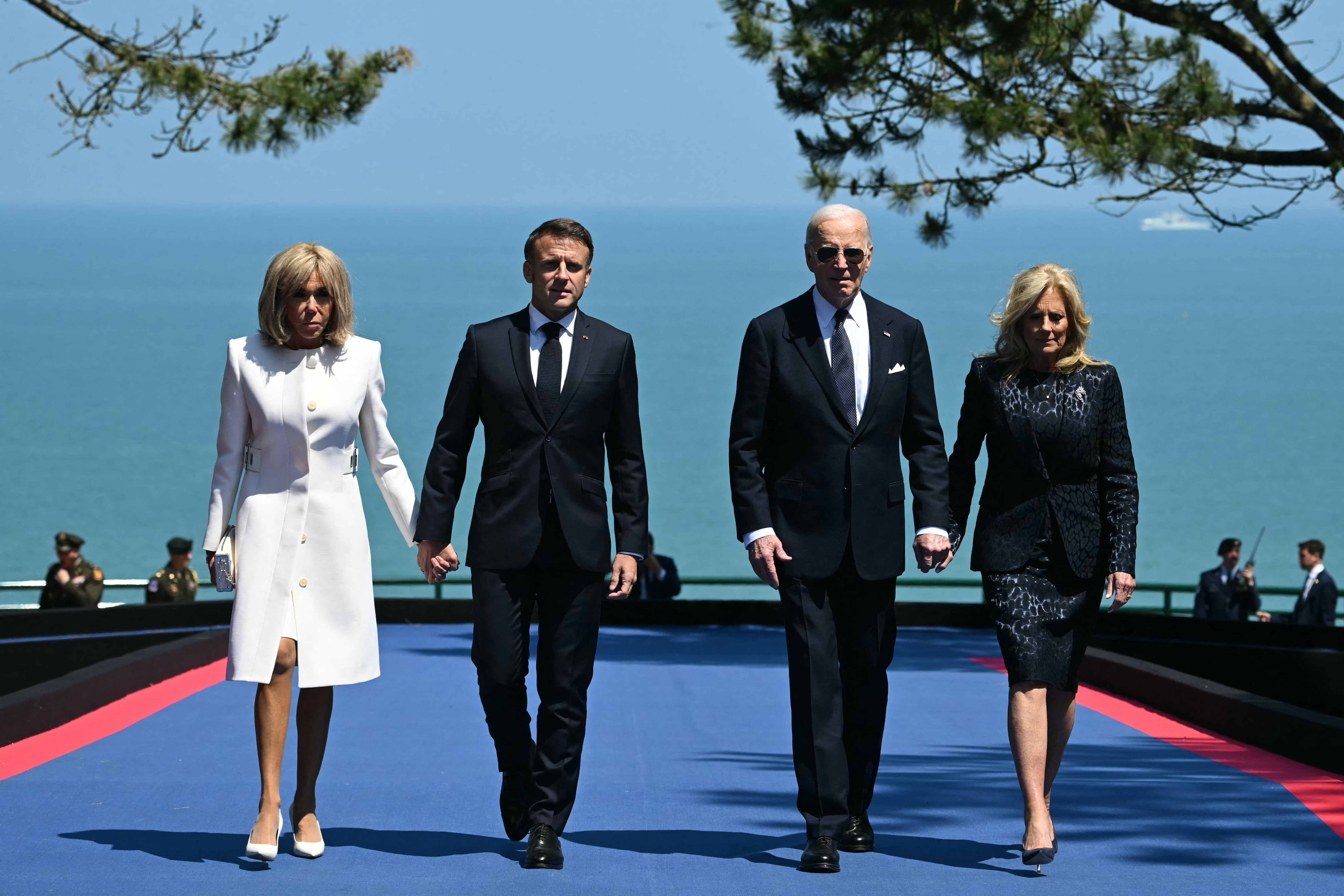 Joe Biden (2nd R) and US First Lady Jill Biden (R) walk with France's President Emmanuel Macron (2nd L) and his wife Brigitte Macron