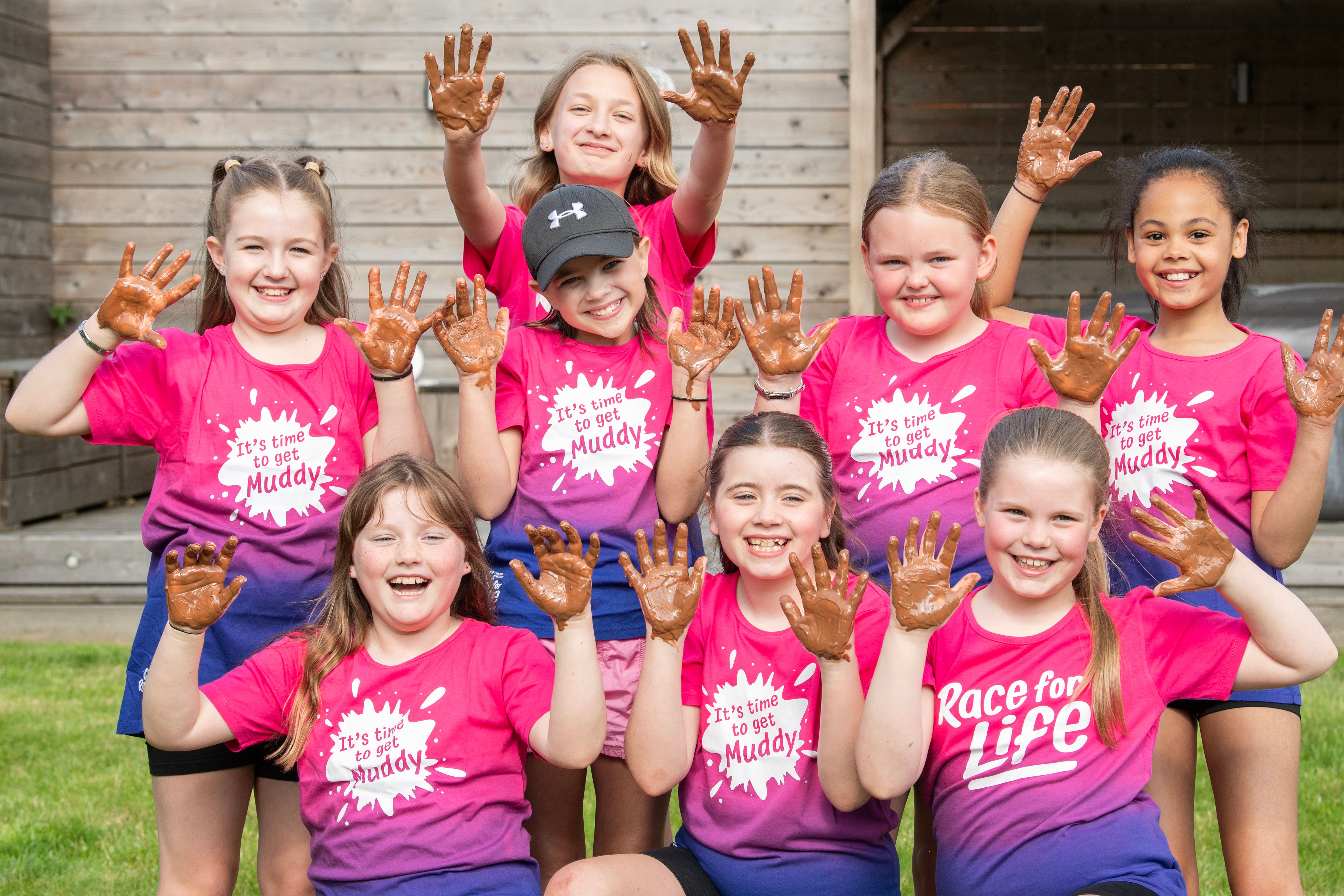 Kara McInally, in cap, and her group of friends will take part in the race later this month (Lesley Martin/Cancer Research UK/PA)
