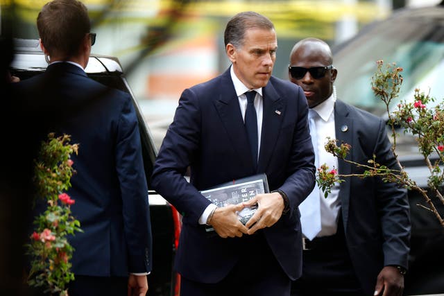 <p>Hunter Biden enters the federal building in Wilmington, Delaware on June 6 carrying a copy of his memoir <em>Beautiful Things</em></p>