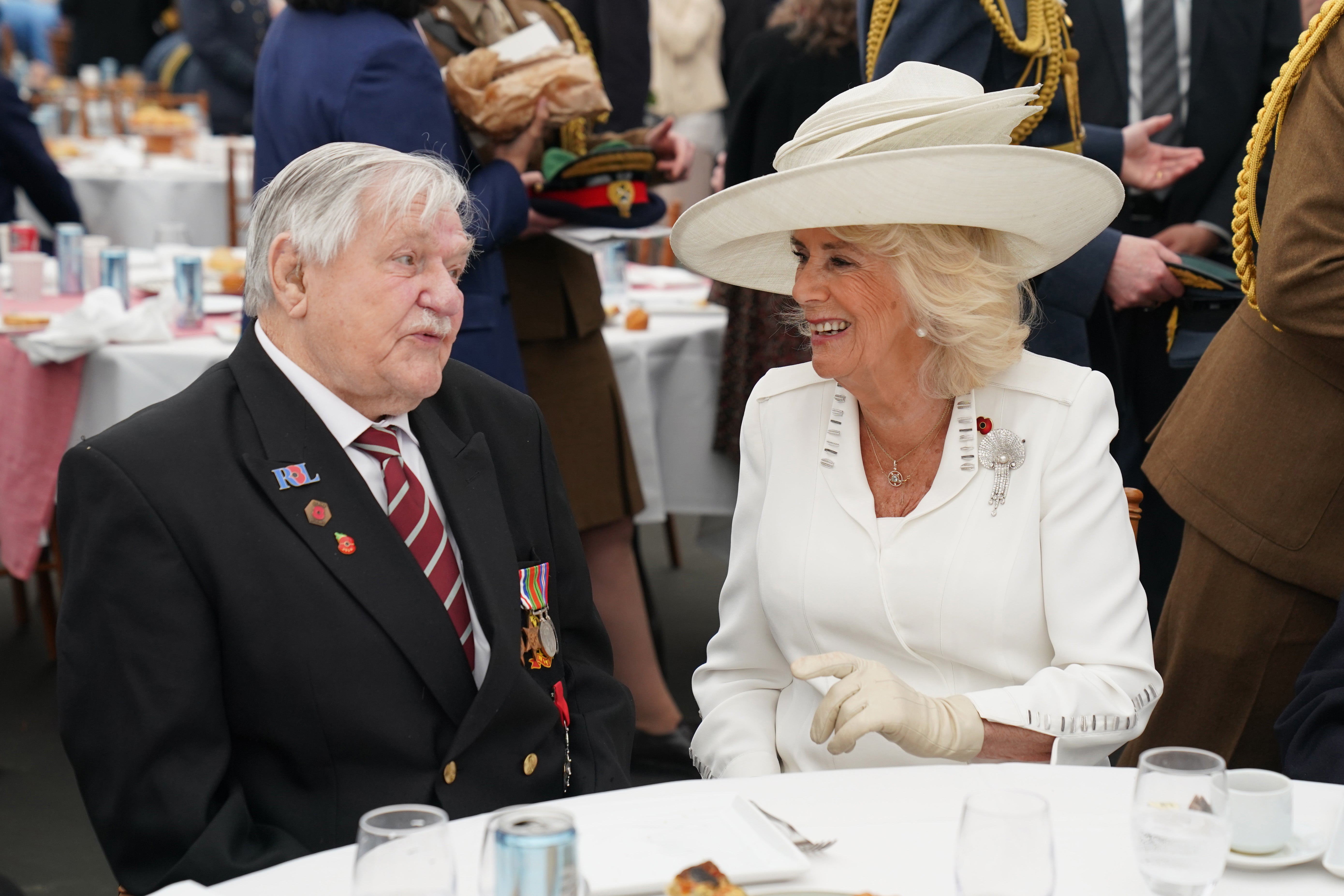 Queen Camilla speaks with veteran Arthur Oborne during a lunch after the event
