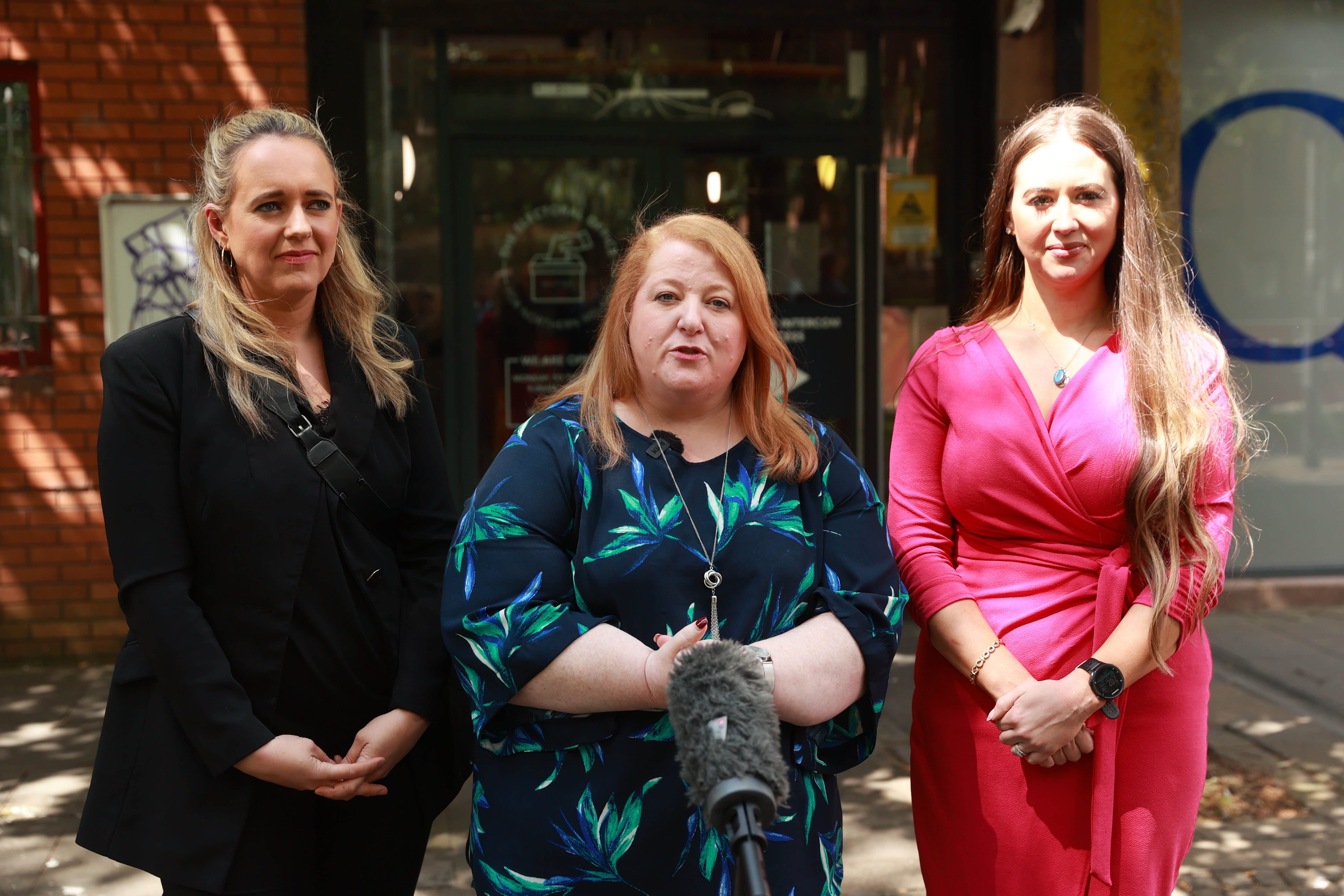 Alliance Party candidates Sorcha Eastwood (right) standing in Lagan Valley, party leader Naomi Long (centre) standing in East Belfast and Kate Nicholl standing in South Belfast, outside the Electoral Office for Northern Ireland in Belfast (Liam McBurney/PA)