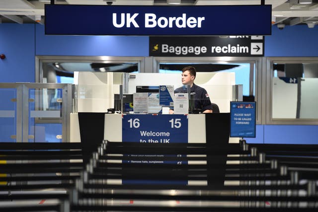 <p>A passport control desk at a UK airport</p>