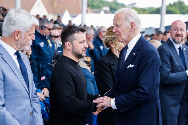 <p>US President Joe Biden (R) shakes hands with Ukraine’s President Volodymyr Zelensky (L) during the International commemorative ceremony at Omaha Beach marking the 80th anniversary of the World War II “D-Day” Allied landings in Normandy, in Saint-Laurent-sur-Mer, in northwestern France, on June 6, 2024</p>