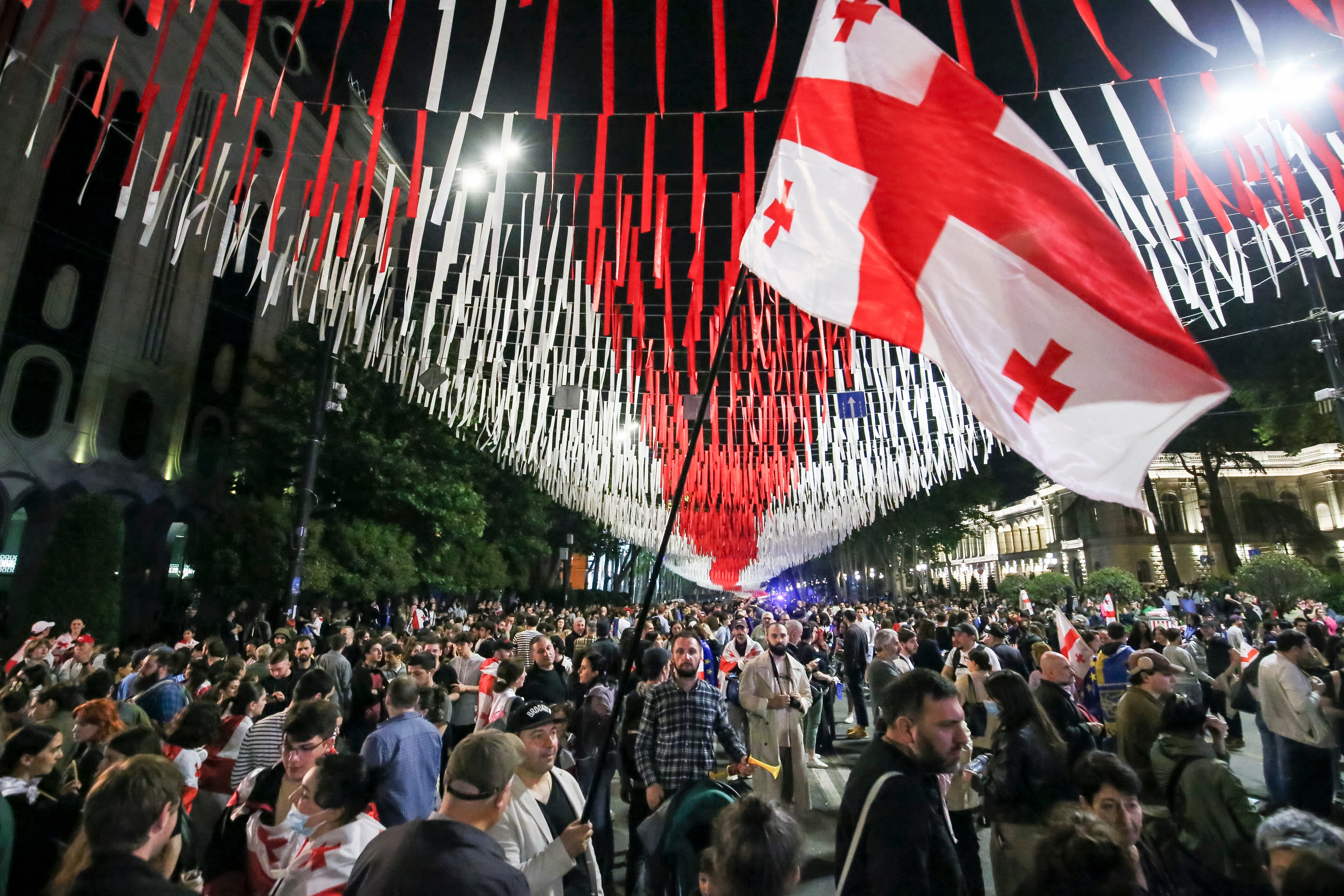 Demonstrators gather at the parliamentary building during an opposition protest