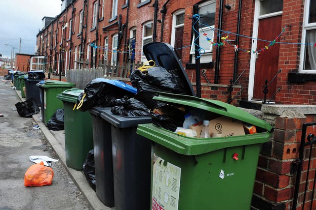 Bags of rubbish and overflowing bins (Anna Gowthorpe/PA)