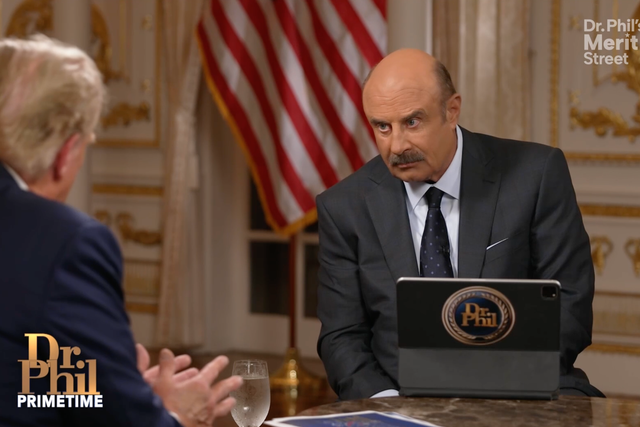 Dr. Phil listens as Donald Trump speaks during an interview that aired on June 6.