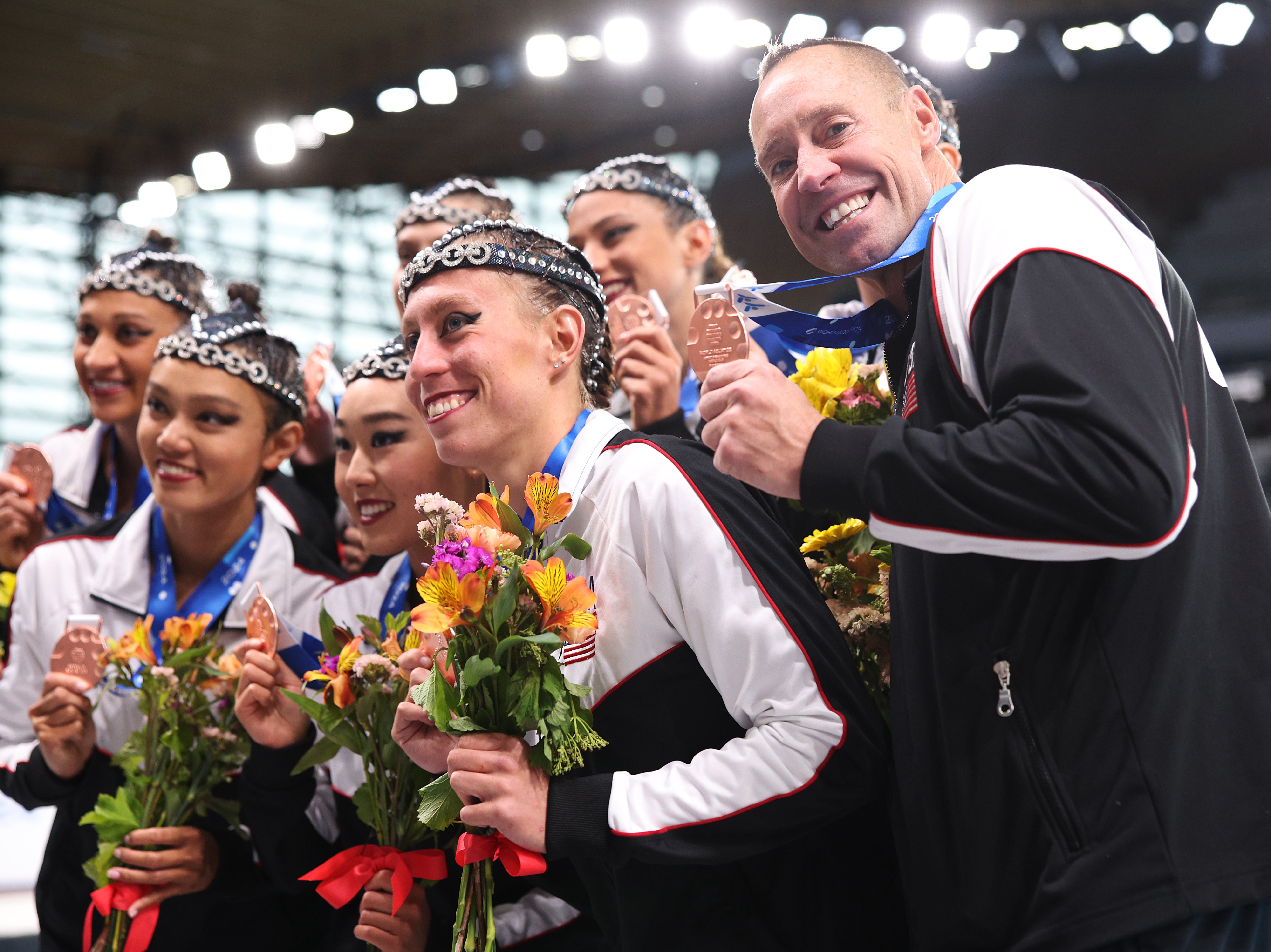 Team USA and Bill May of Team USA celebrate with their bronze medals after the Mixed Team Acrobatic during the World Aquatics Artistic Swimming World Cup 2024 at Aquatics Centre on 5 May 2024 in Paris, France (Getty Images)