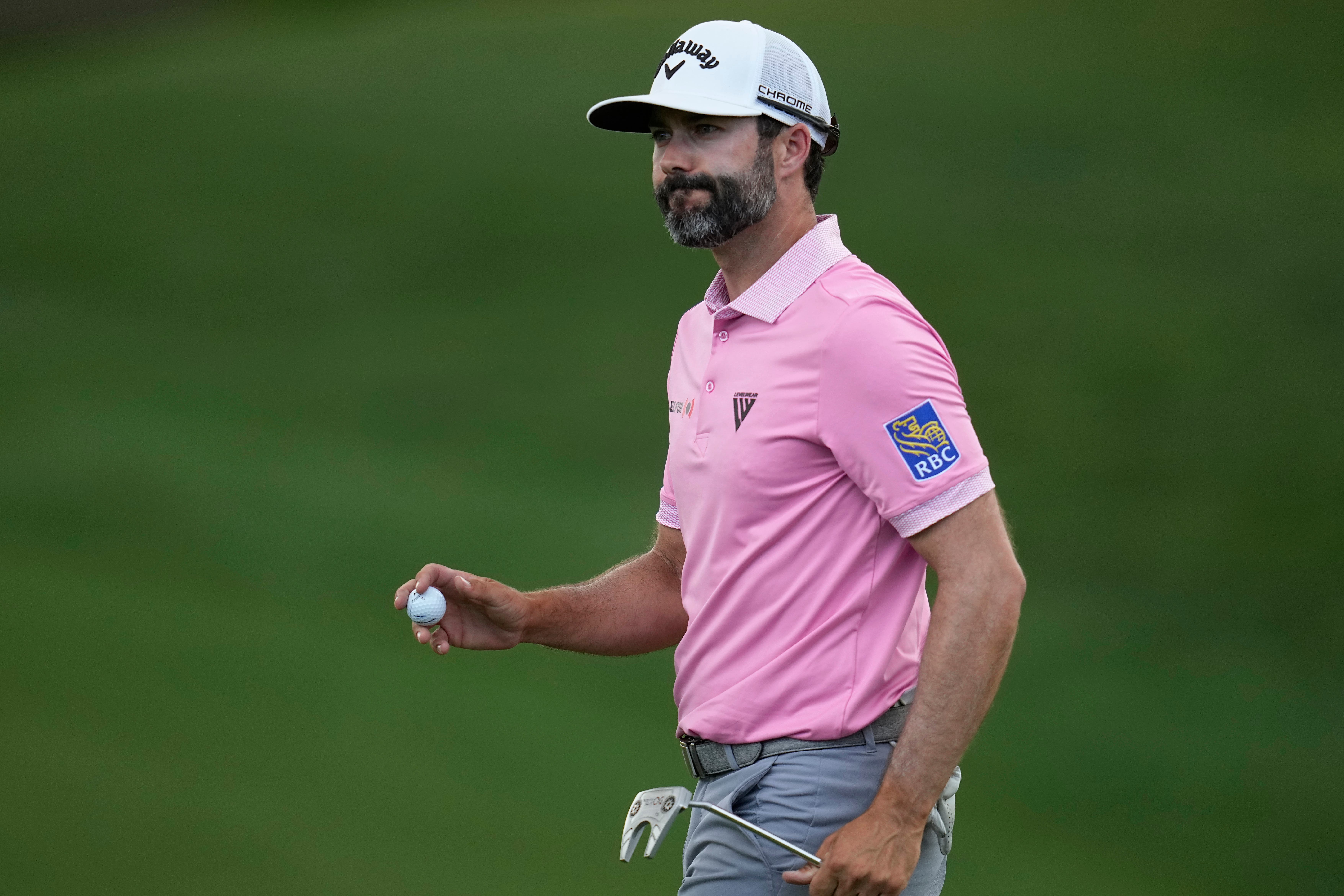 Adam Hadwin gestures after putting on the 18th green in the first round of the Memorial golf tournament (Sue Ogrocki/AP)