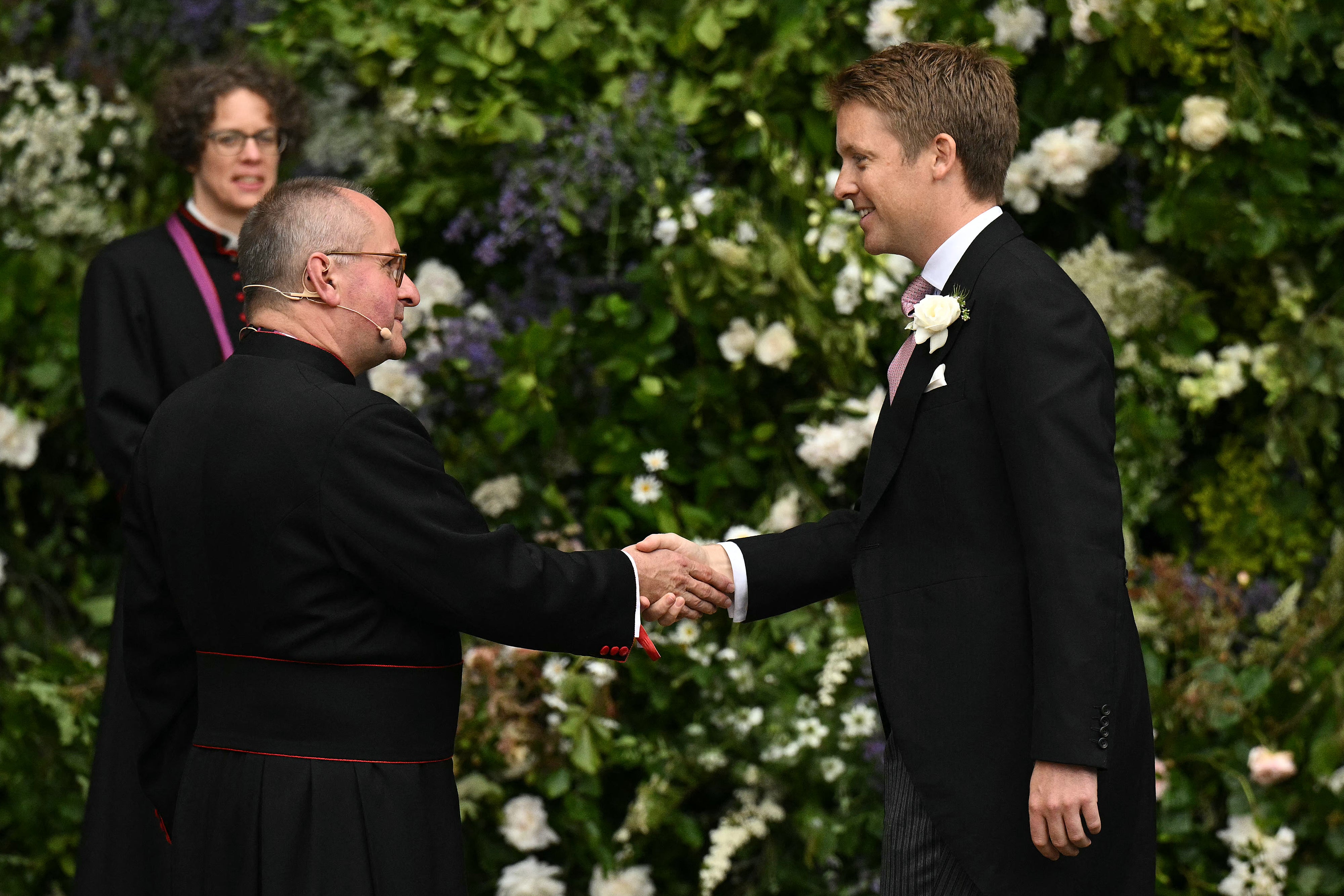 Hugh Grosvenor shakes hands outside the cathedral ahead of his wedding