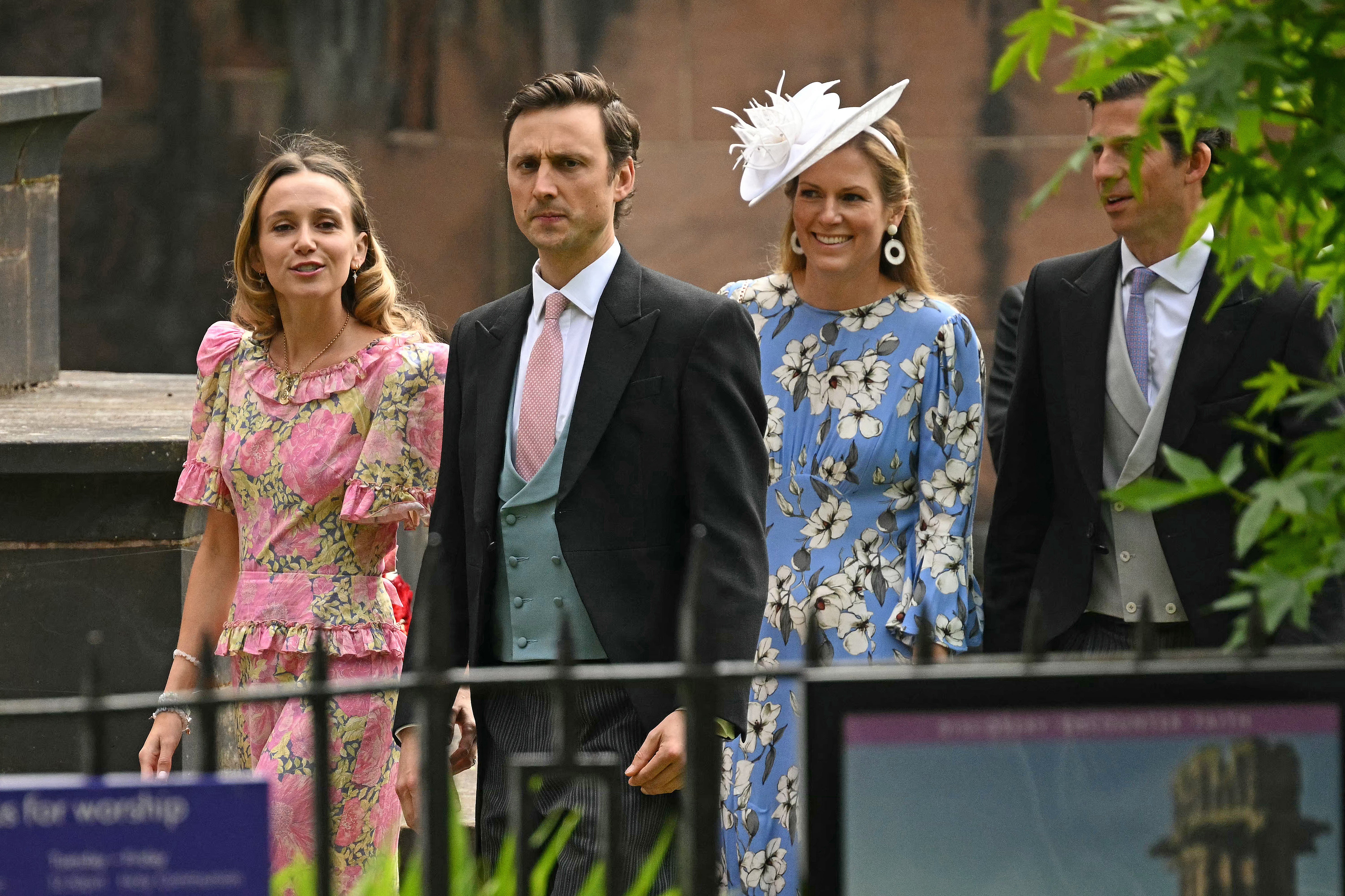 Charles van Straubenzee (L) and his wife Daisy Jenks (L) arrive to attend the wedding