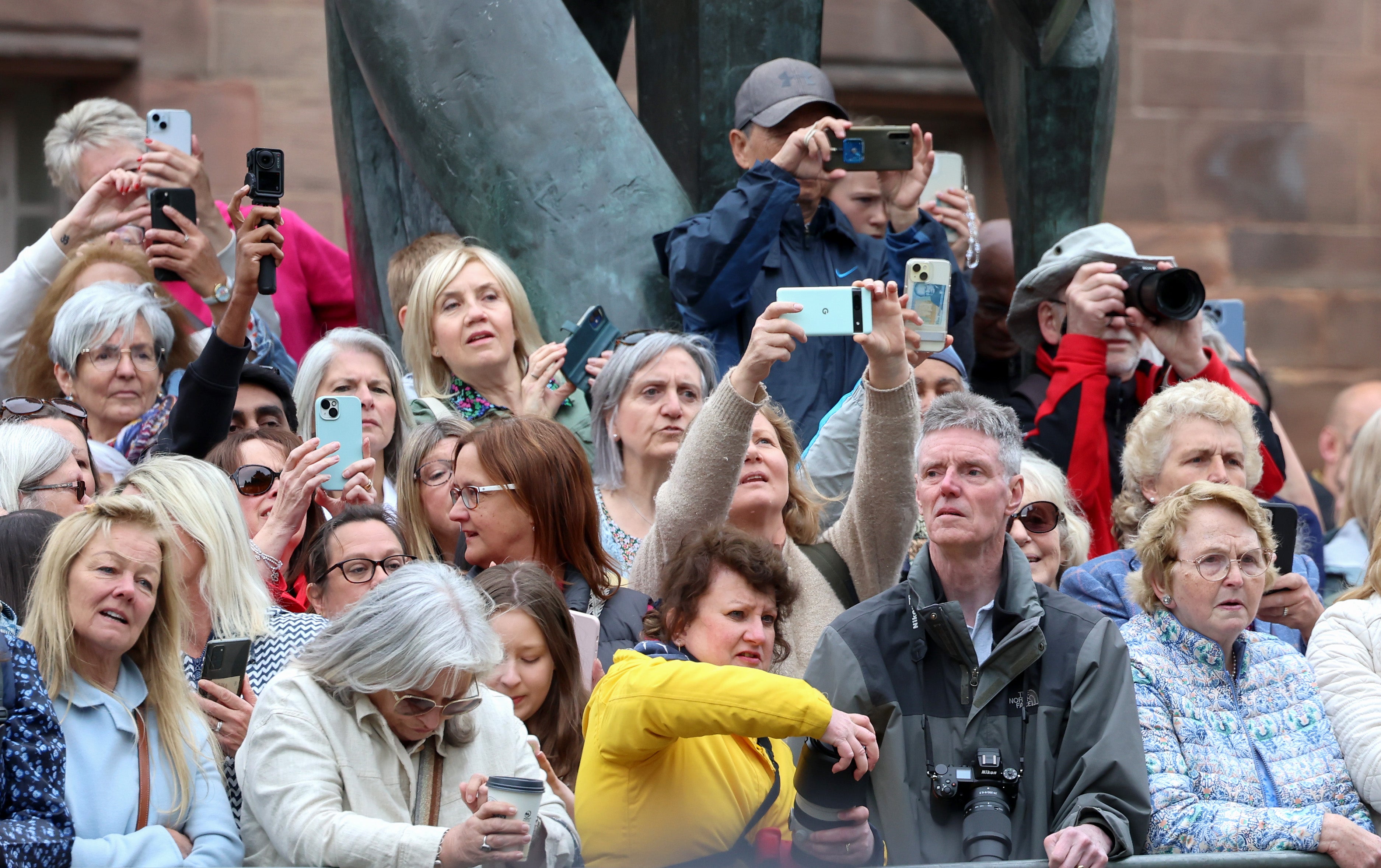 Cameras are at the ready for the arrival of the bride