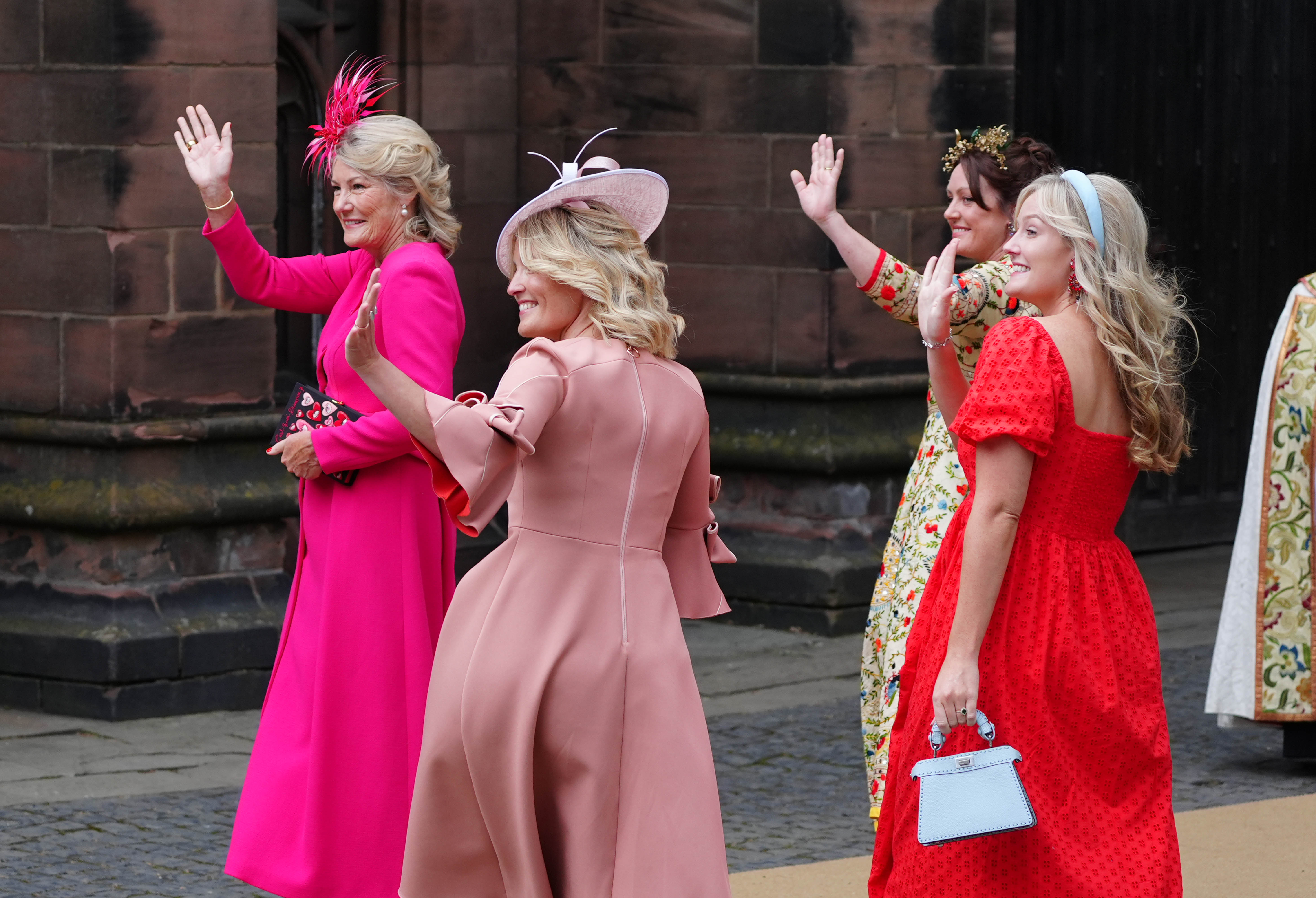 The groom’s mother, Natalia Grosvenor, waves to the crowds